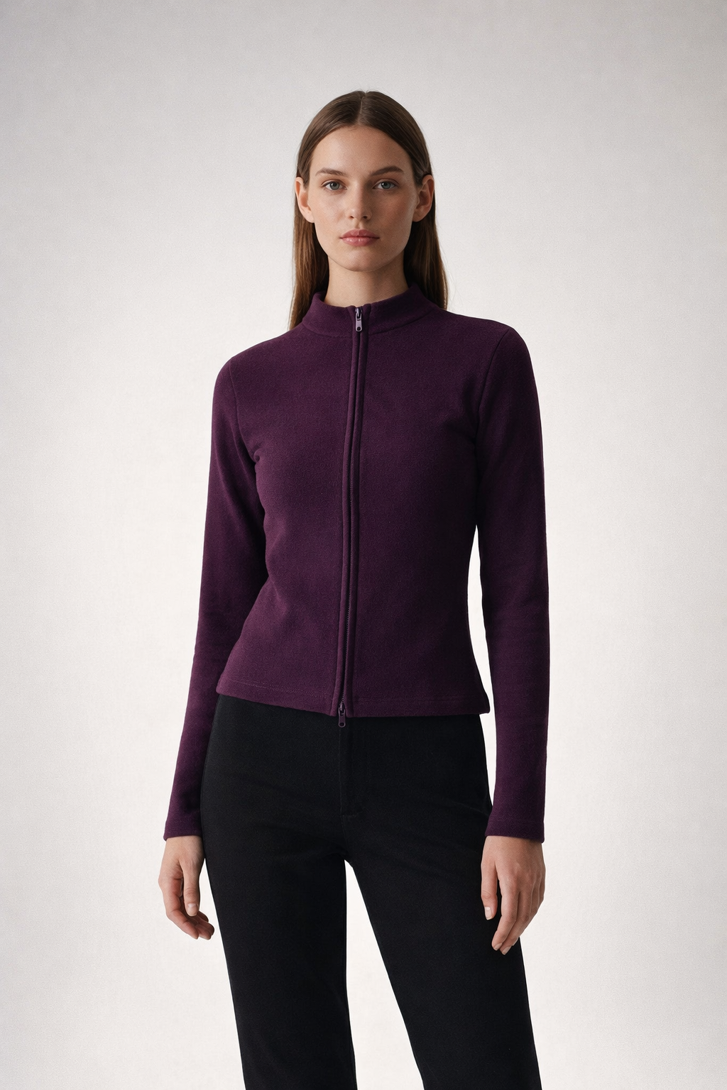 Dark purple cropped zip top with high neck and long sleeves