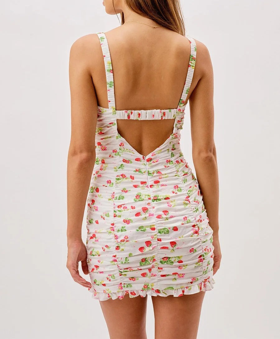 White ruched mini dress with floral and strawberry print