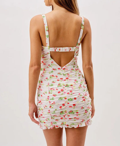 White ruched mini dress with floral and strawberry print