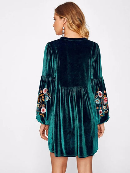 Dark green embroidered long sleeve mini dress with tassel detail