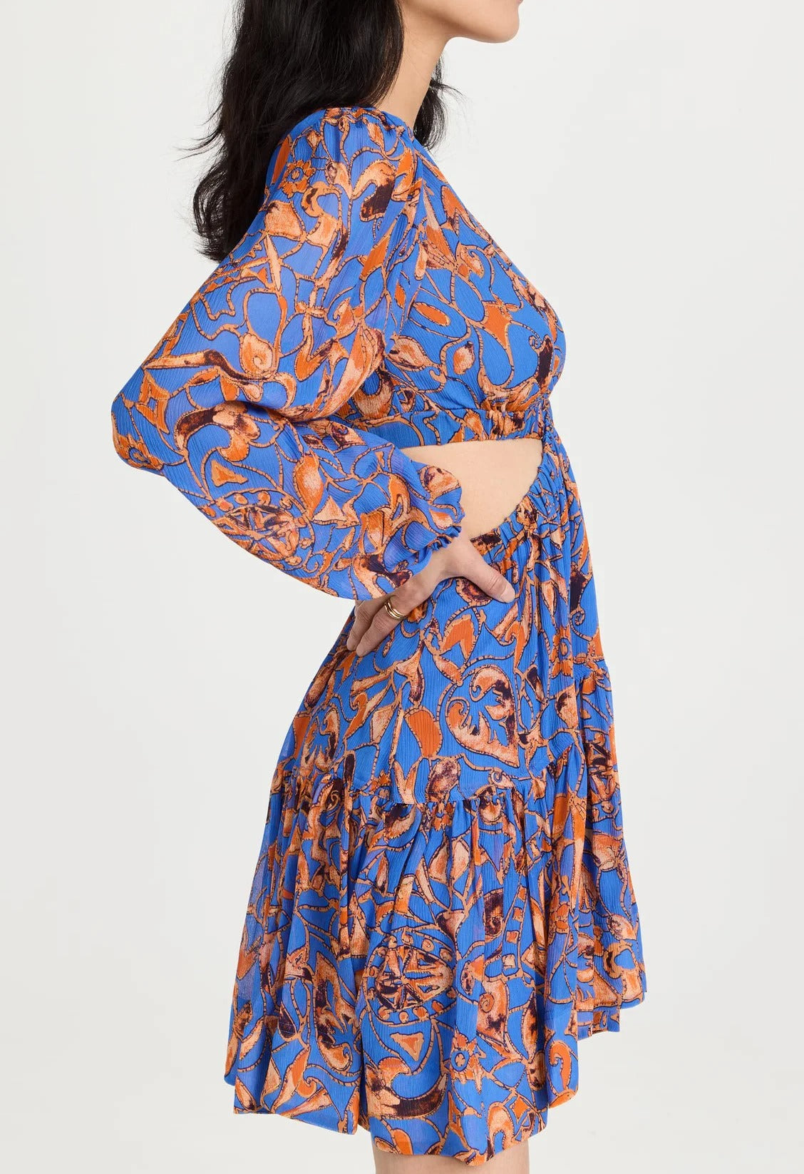 Blue patterned cut-out mini dress with long sleeves