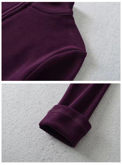 Dark purple cropped zip top with high neck and long sleeves